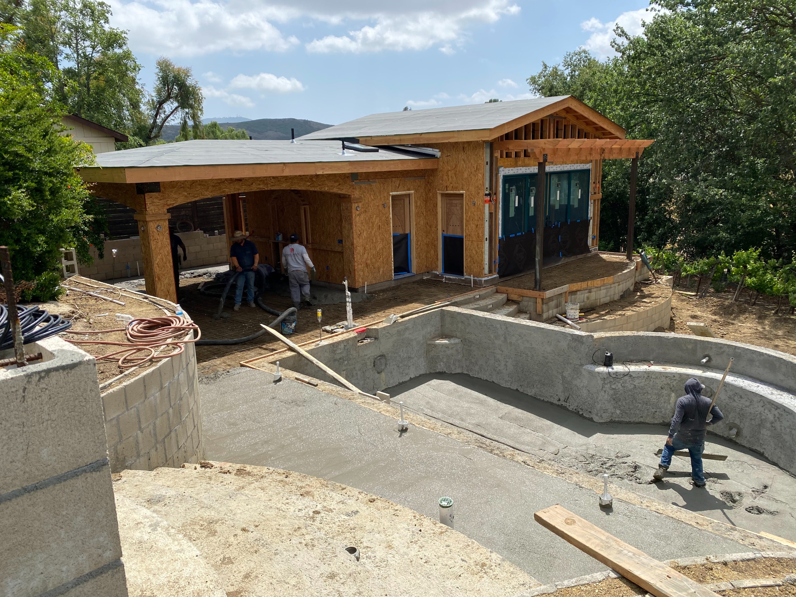 Craftsmanship in motion. Our team pours, shapes, and reinforces the custom pool and ADU foundation.