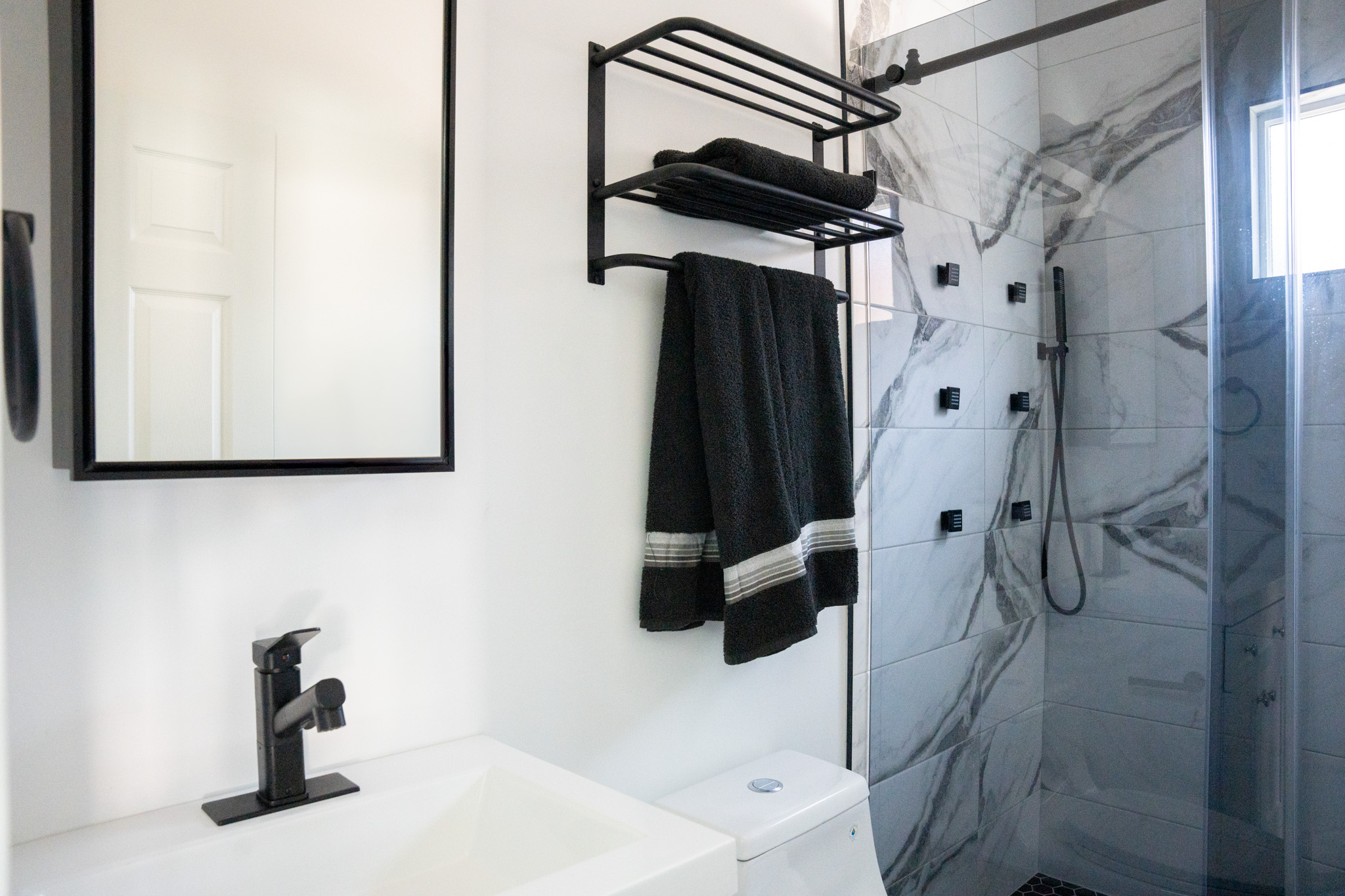 Generously sized walk-in shower in the Encina ADU bathroom.