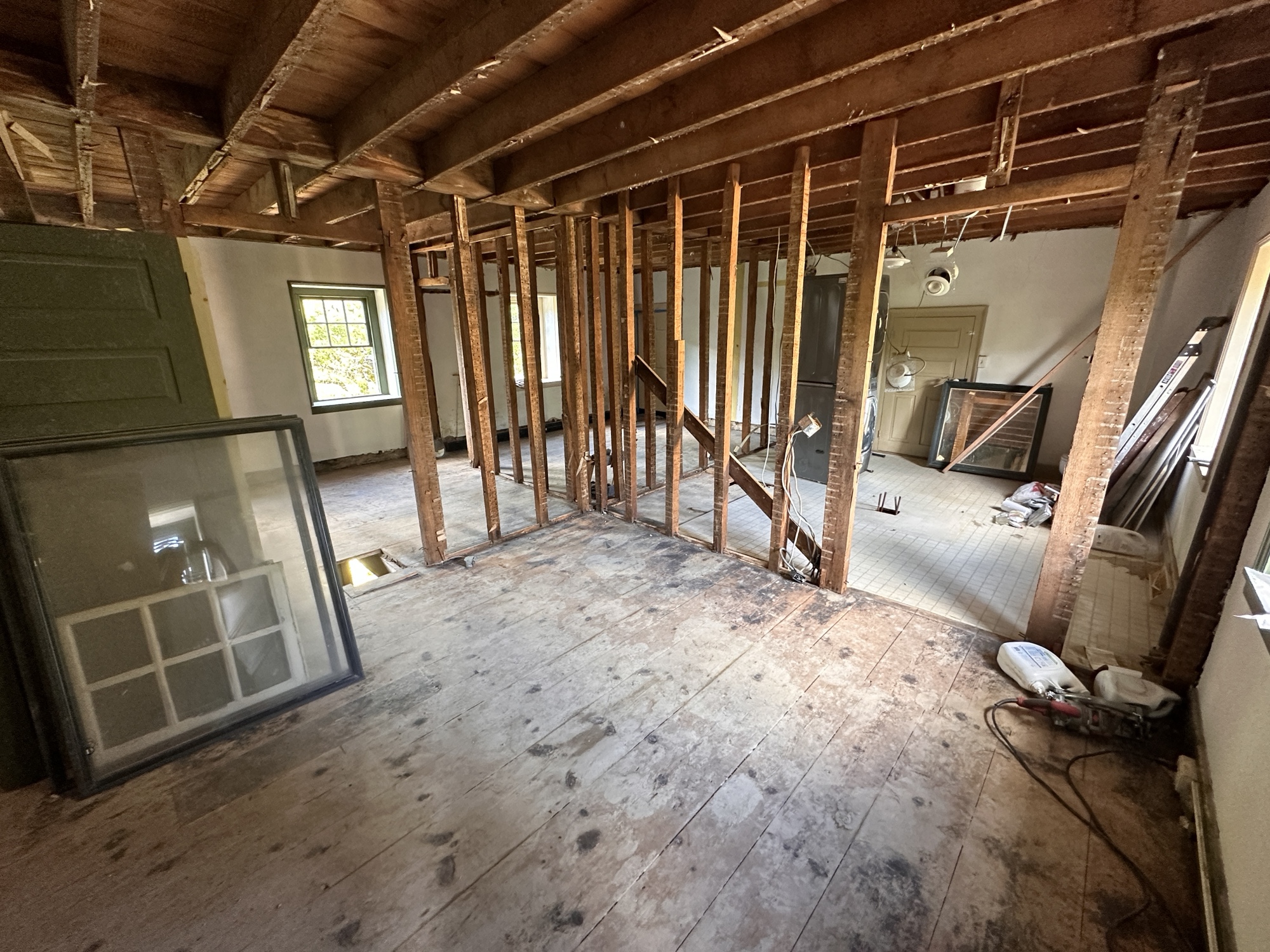 This project involved a complete reimagining of the second floor of an 1800s farmhouse, where we removed the existing layout and designed an entirely new floor plan to maximize space, light, and livability. Every element—from framing and finishes to flooring and trim—was rebuilt with care to preserve the home’s historic character while introducing modern craftsmanship and comfort.
As part of the renovation, we created a new guest bathroom that seamlessly blends old and new. The space features a soaking tub framed by original stonework, a custom vanity, and a bluestone slate bench that ties the design back to the home’s rustic heritage. The overall result is a second floor that feels cohesive, timeless, and thoughtfully refreshed—maintaining the farmhouse’s history while elevating its function for modern living.
If you’re planning a farmhouse renovation or whole-home remodel in Bucks or Montgomery County, Today Homescaping specializes in transforming historic properties with a balance of authenticity, craftsmanship, and contemporary design.