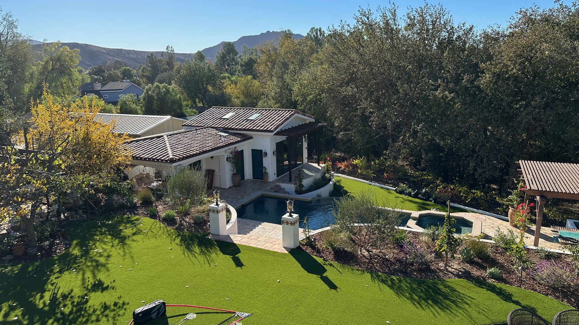 The finished oasis — luxury ADU, full entertainment deck, custom pool, spa, and landscaped retreat.