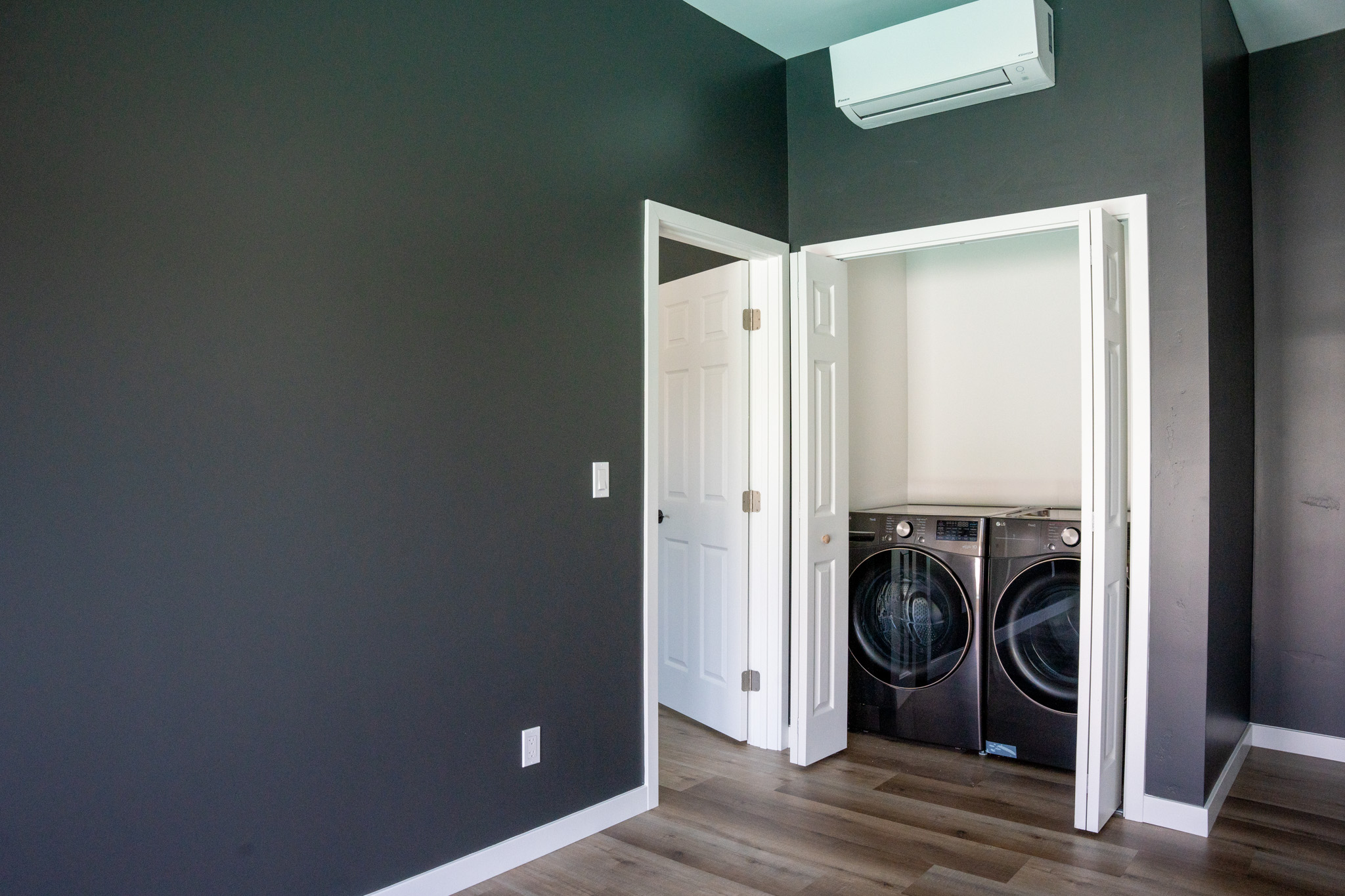 Stacked washer and dryer closet in the Encina ADU.