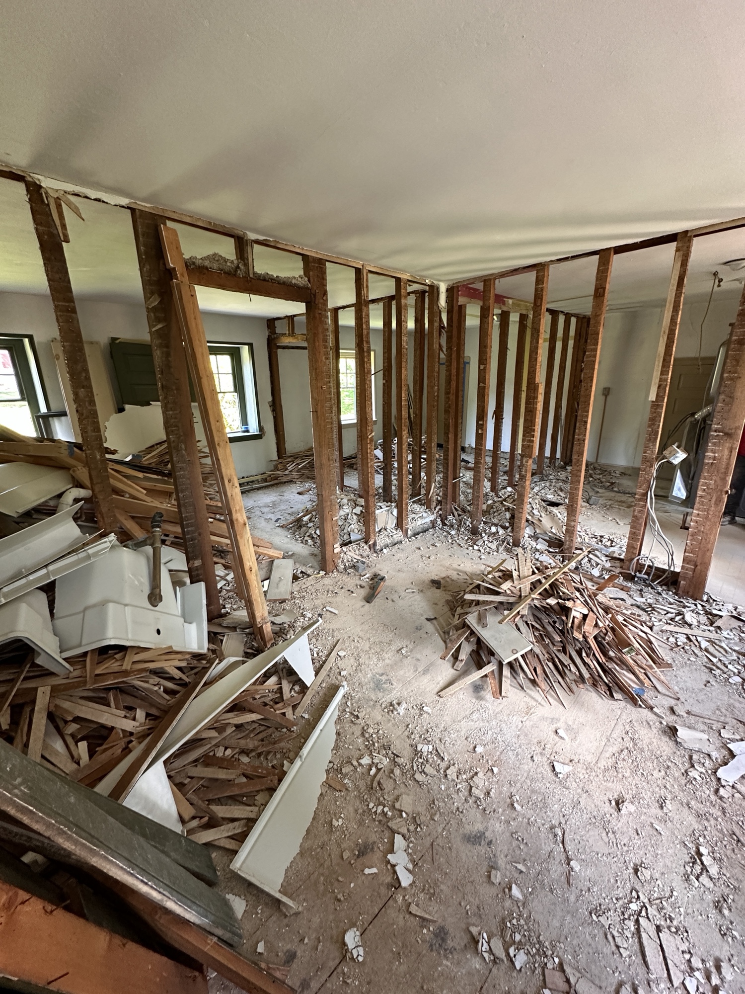 This project involved a complete reimagining of the second floor of an 1800s farmhouse, where we removed the existing layout and designed an entirely new floor plan to maximize space, light, and livability. Every element—from framing and finishes to flooring and trim—was rebuilt with care to preserve the home’s historic character while introducing modern craftsmanship and comfort.
As part of the renovation, we created a new guest bathroom that seamlessly blends old and new. The space features a soaking tub framed by original stonework, a custom vanity, and a bluestone slate bench that ties the design back to the home’s rustic heritage. The overall result is a second floor that feels cohesive, timeless, and thoughtfully refreshed—maintaining the farmhouse’s history while elevating its function for modern living.
If you’re planning a farmhouse renovation or whole-home remodel in Bucks or Montgomery County, Today Homescaping specializes in transforming historic properties with a balance of authenticity, craftsmanship, and contemporary design.